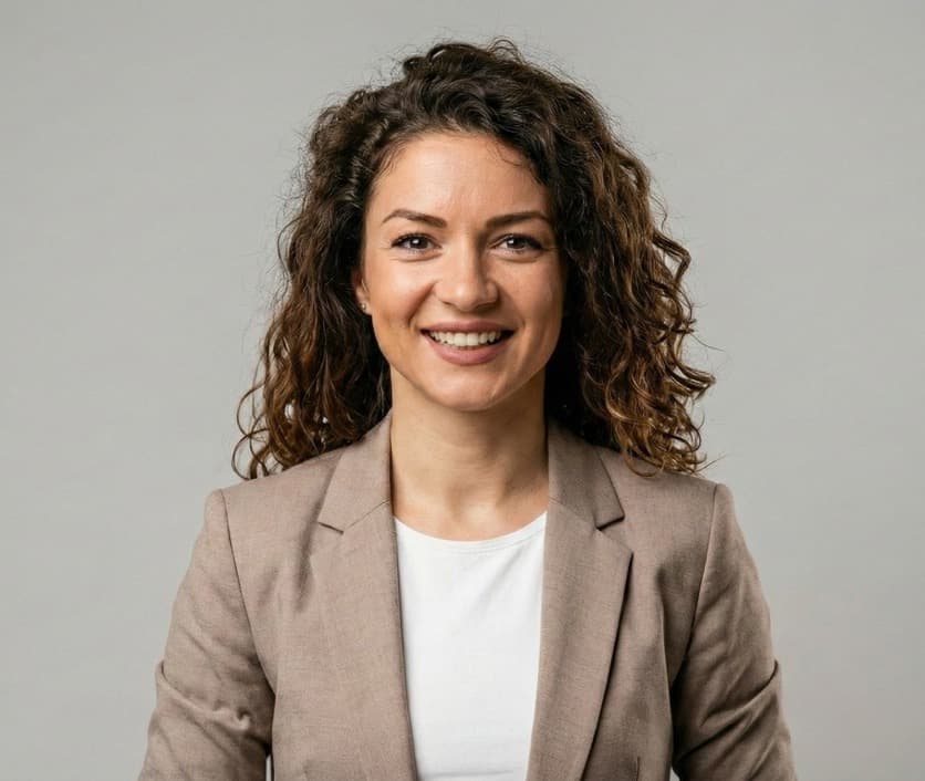 Sofia, smiling, wearing a headset